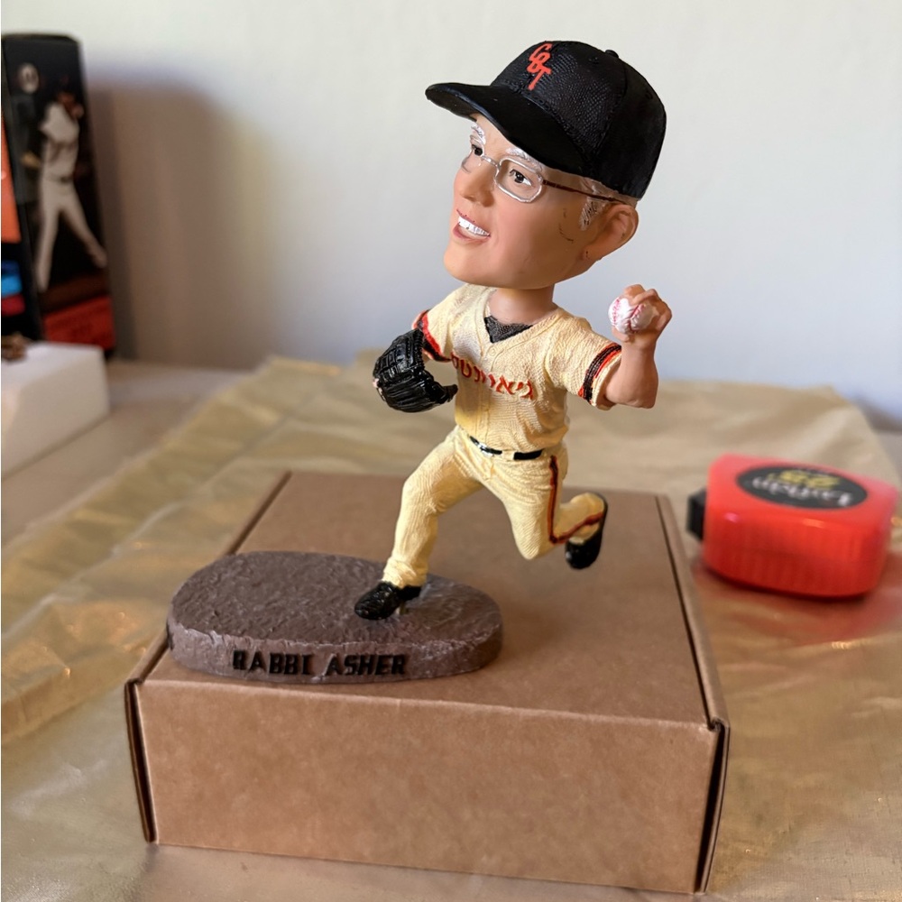 This rare 2014 Rally Rabbi Asher Bobblehead is a must have for any baseball fan.